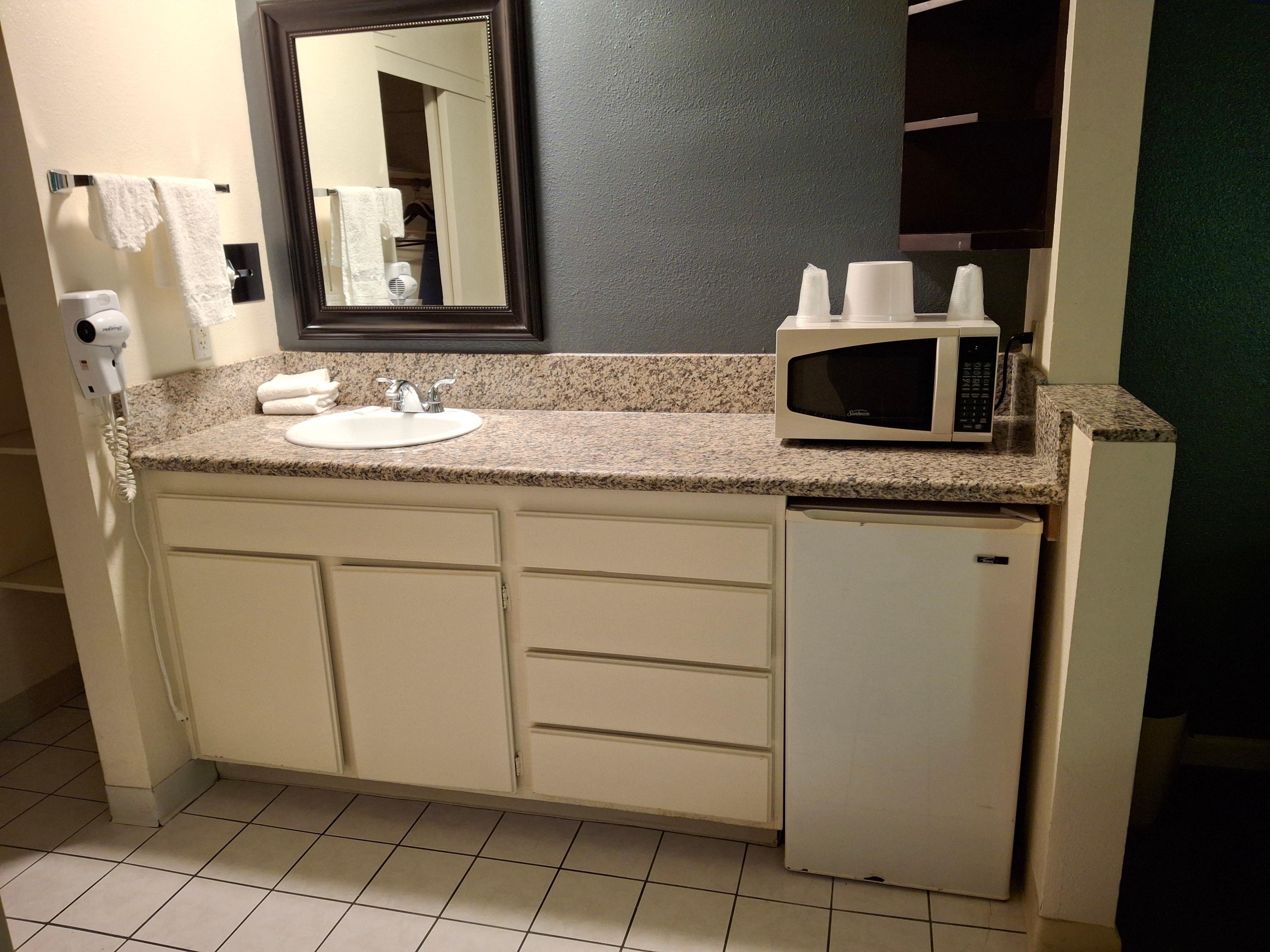 Newer countertop & mirror in first renovated room. That & paint were the extent of renovations.