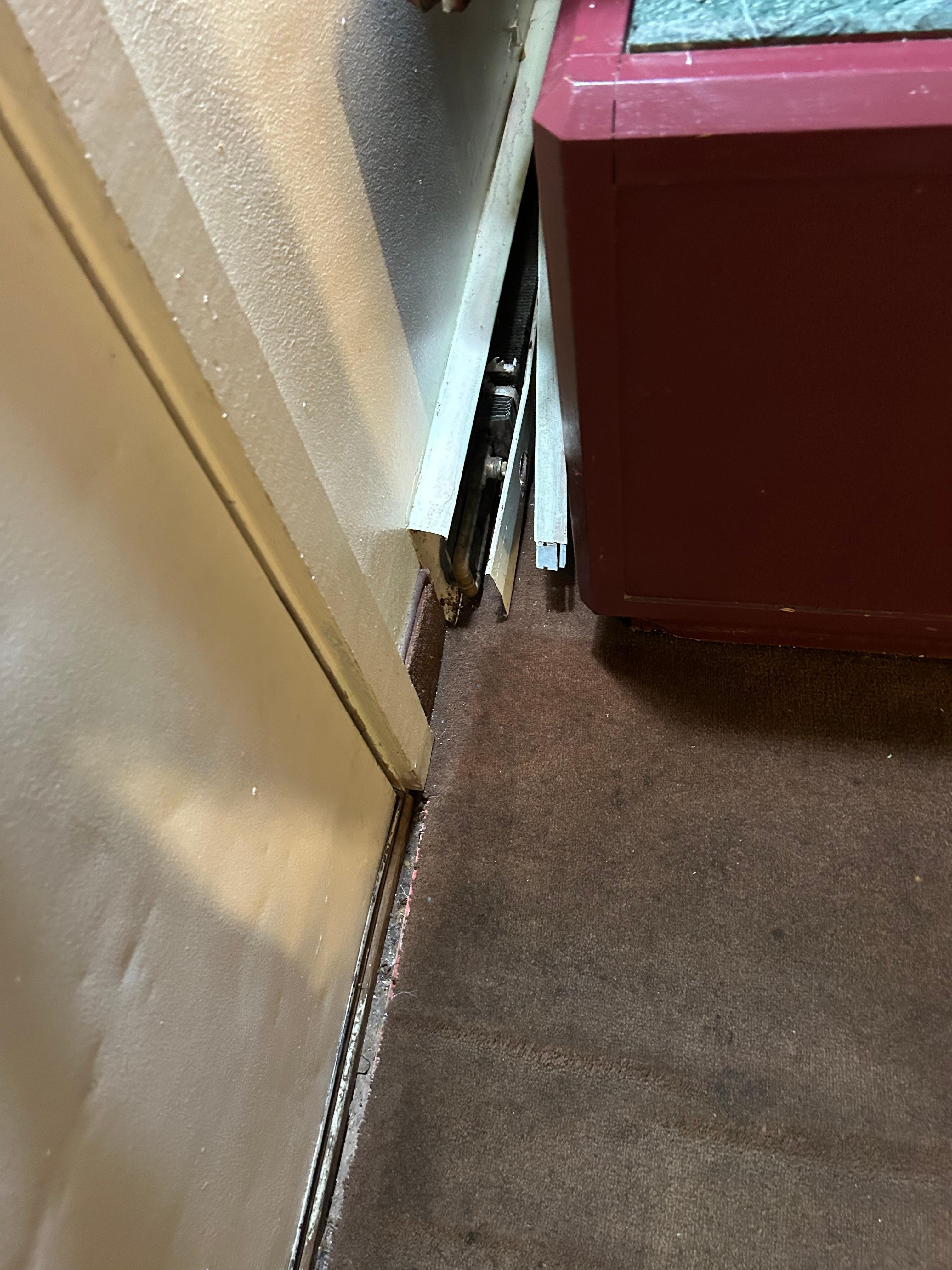 Photos on your site are very deceptive.  Third photo shows you can take a corner of the carpet and rip it up.