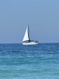 Sail boat floating around