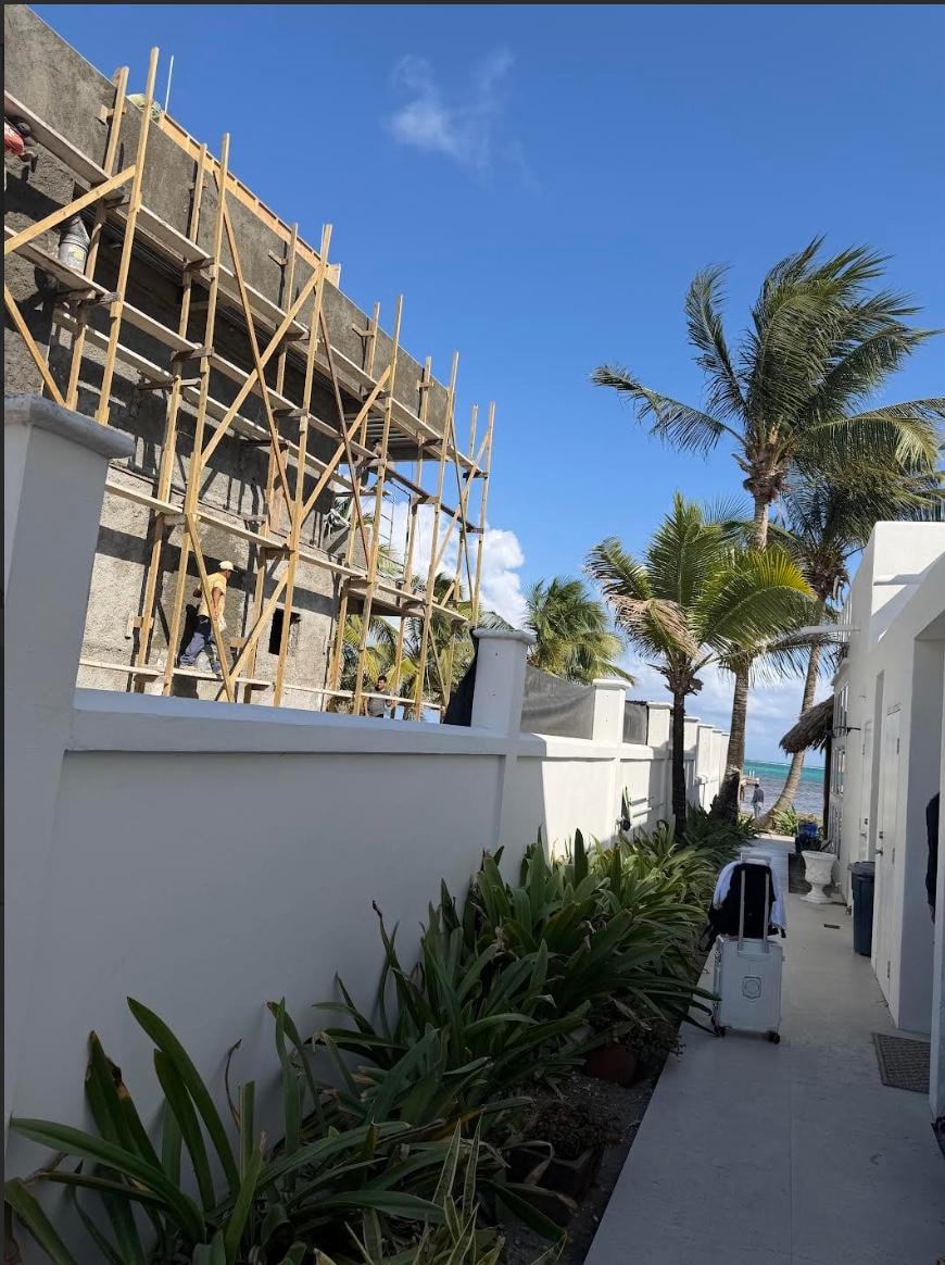 To the left & outdoor shower 