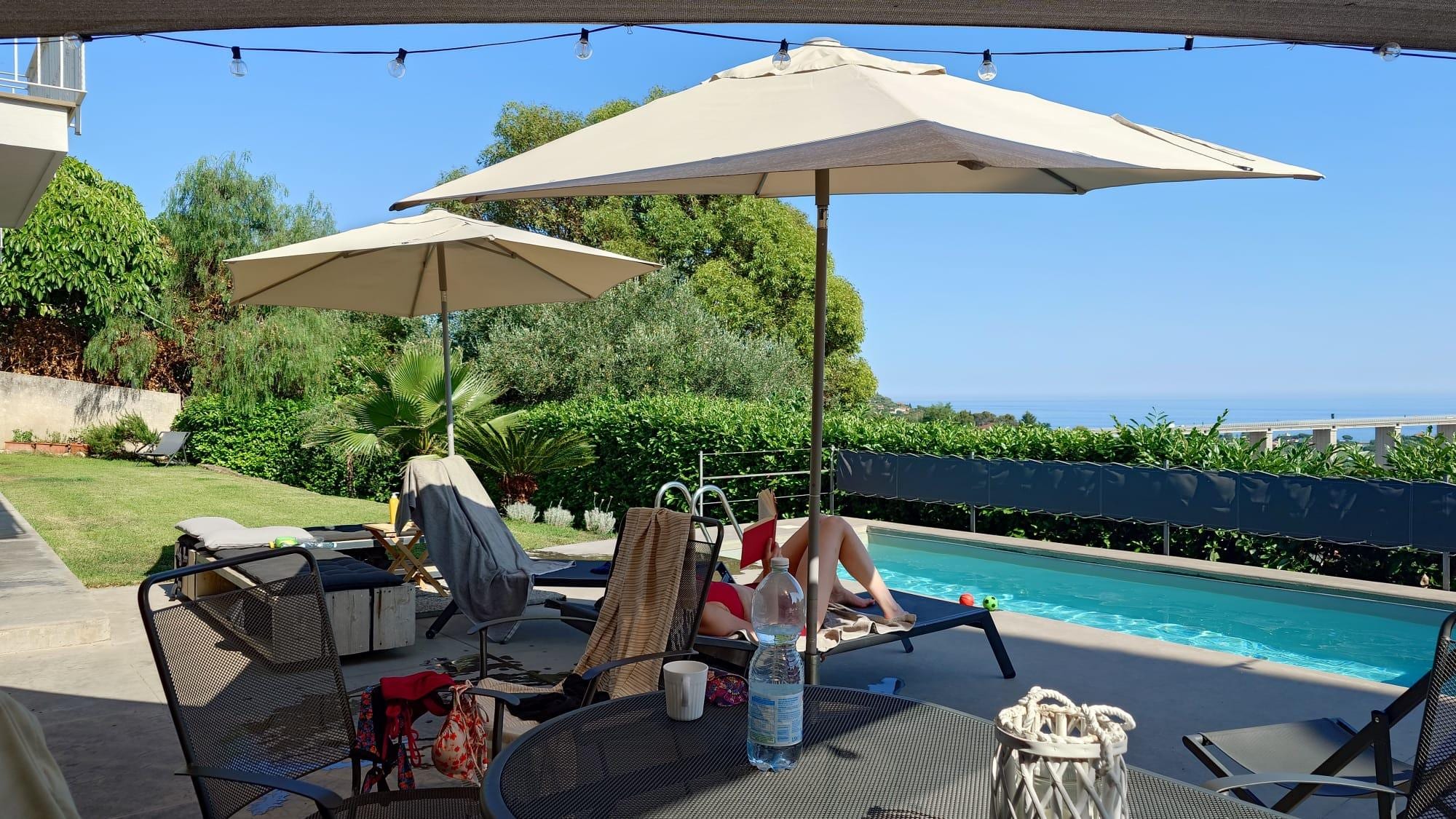Enjoying the pool and the ocean view.