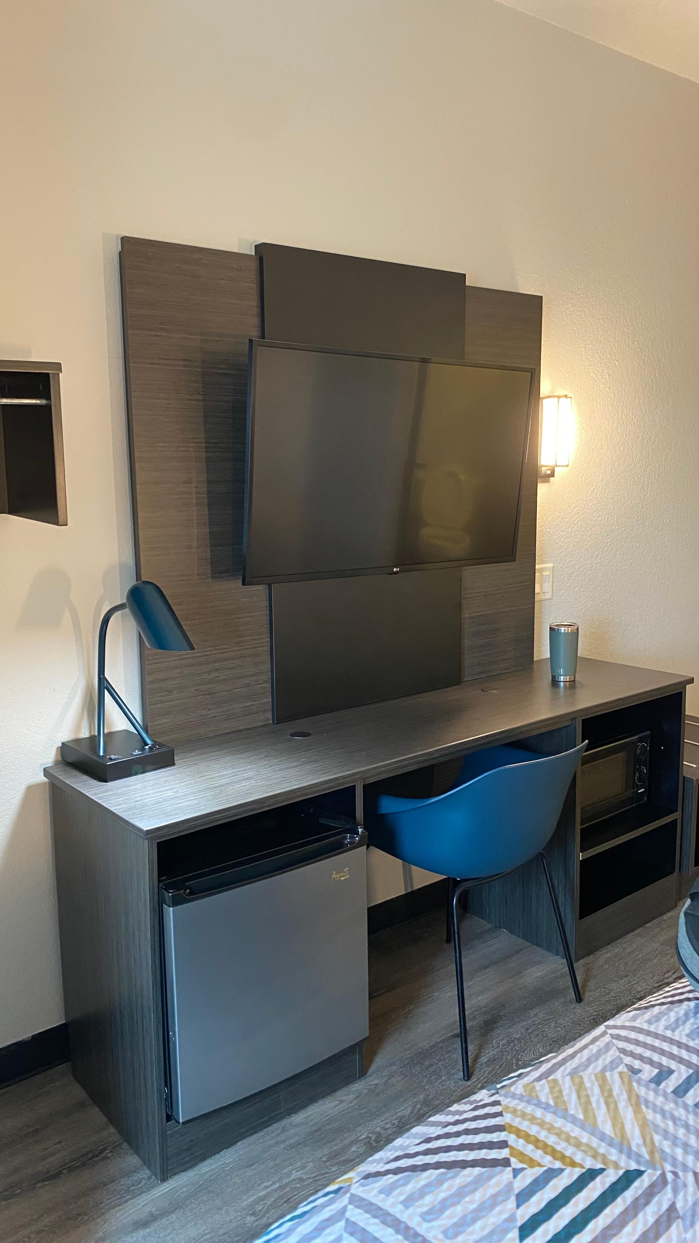 I did not expect for the tv to have the wall mount on full motion, You can turn it, extended, shorten it, awesome lol, mini fridge is alright, doesn’t put the drinks too cold (but that’s just me) but it does get the job done