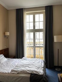 Very elegant room with door opening onto a balcony