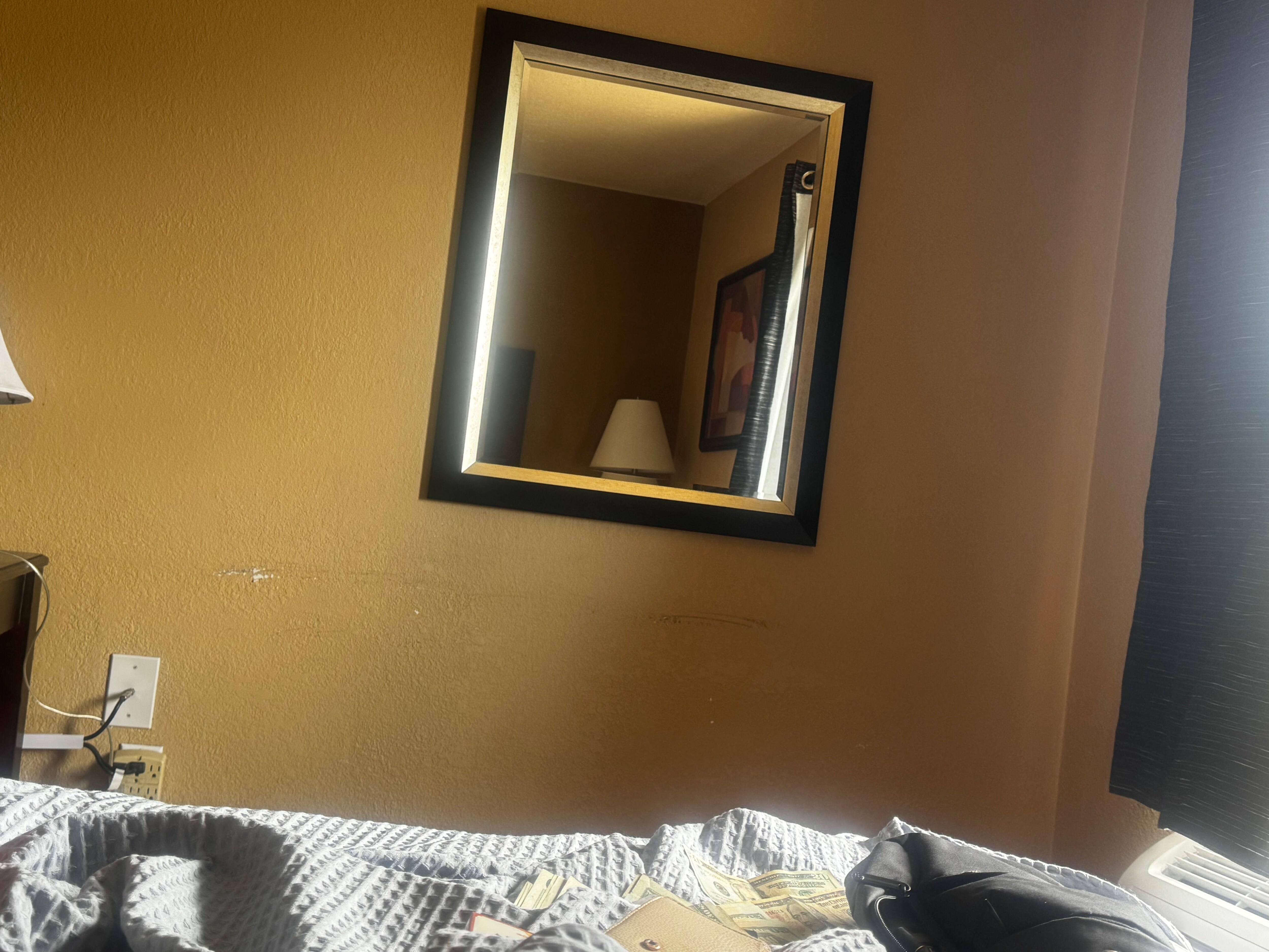 Paint missing on wall. Large scuff.