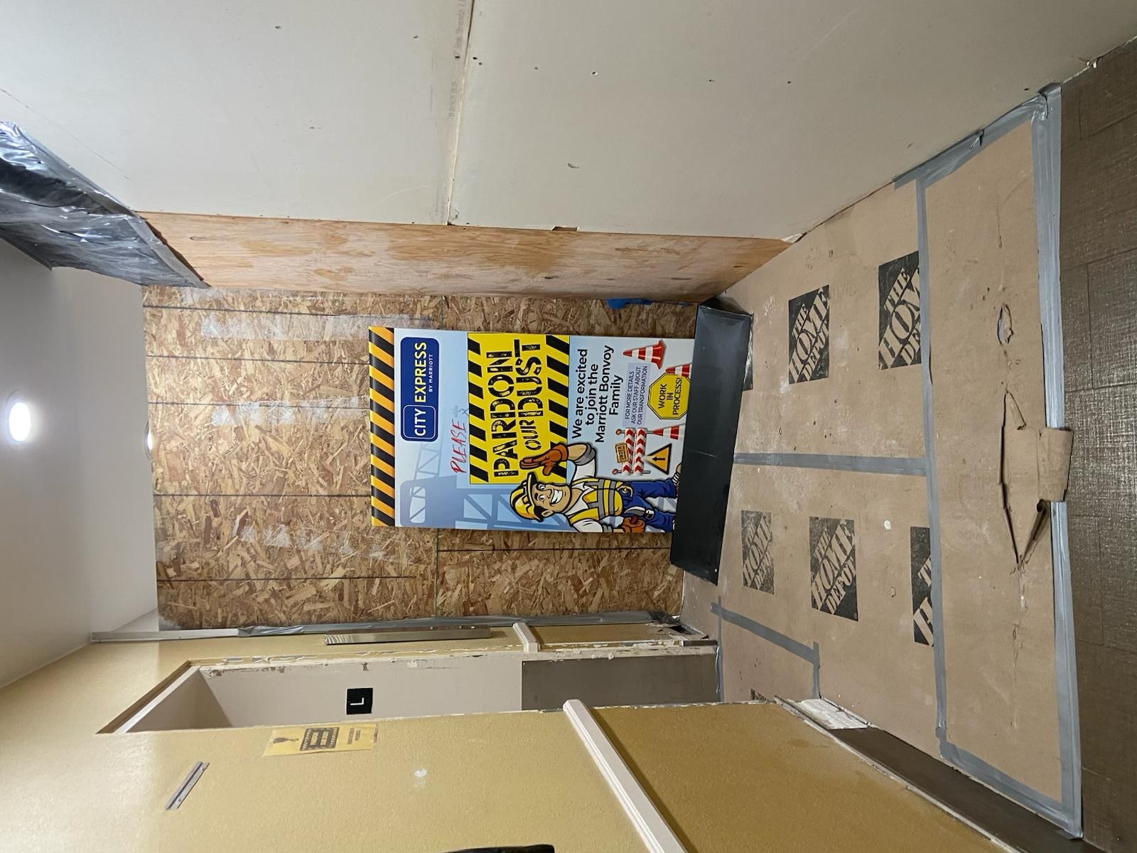 One elevator working, sign disclosing about the dust and lobby walkway closed. Had to walk through this area to access the elevator. 