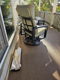 The kick plate of the leaking dishwasher left out on the lanai to dry out and for us to enjoy with our view.