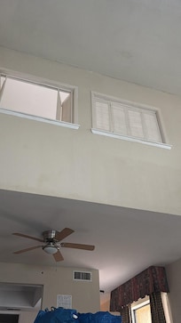 Sitting on the couch, looking up. High ceiling also makes noise travel easier