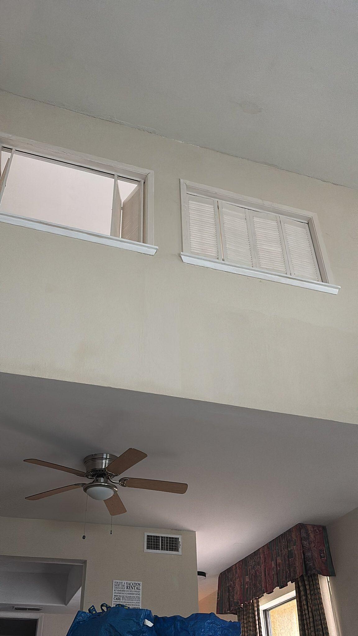 Sitting on the couch, looking up. High ceiling also makes noise travel easier 
