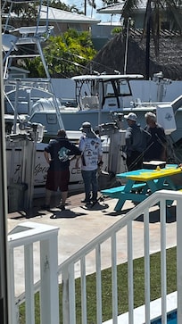 Awaiting fishing trip with owner (charter or friend...from the observed dynamic it appeared to be a charter)