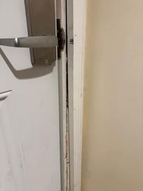 Front door was unsafe and did not close properly.