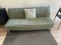 This was the only place you could sit to watch tv. It looked like the back seat of an old car that had legs added to it.