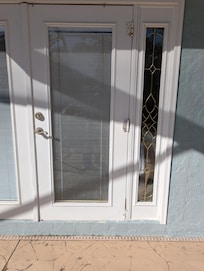 Outside of French doors, bolted shut and moldy