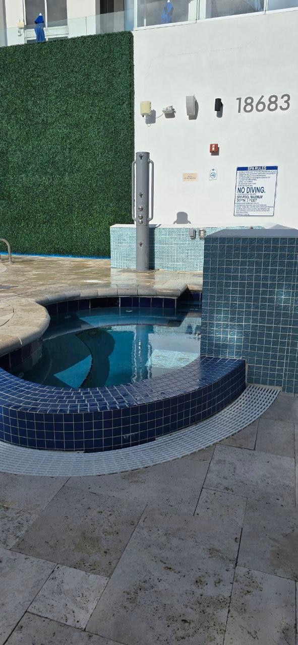 Outside shower too close to the hot tub, hot tub was also designed poorly