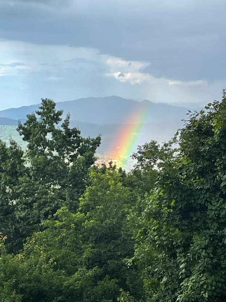 Afternoon thunderstorm and rainbow ending in Gatlinburg.