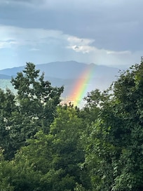 Afternoon thunderstorm and rainbow ending in Gatlinburg.