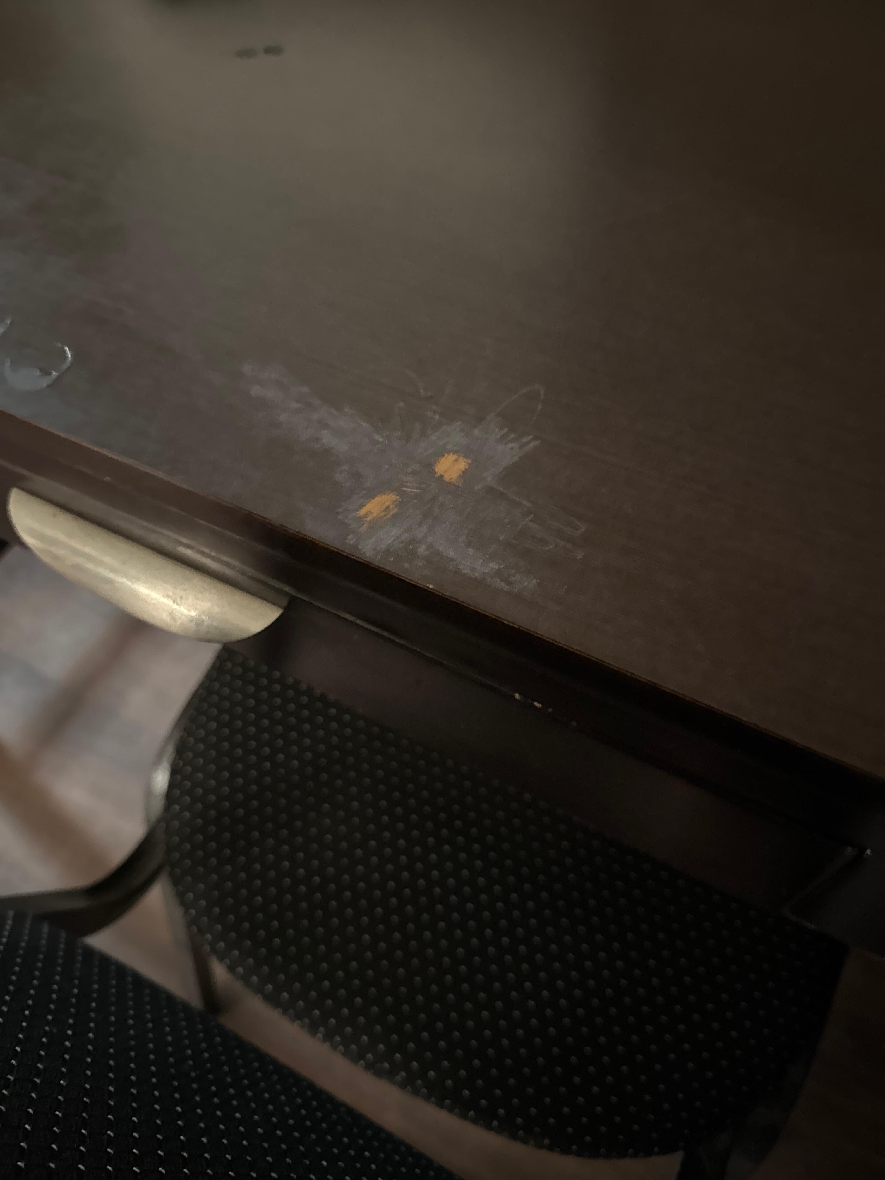 Burn marks on desk