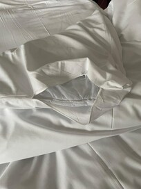 Torn bed linen.
