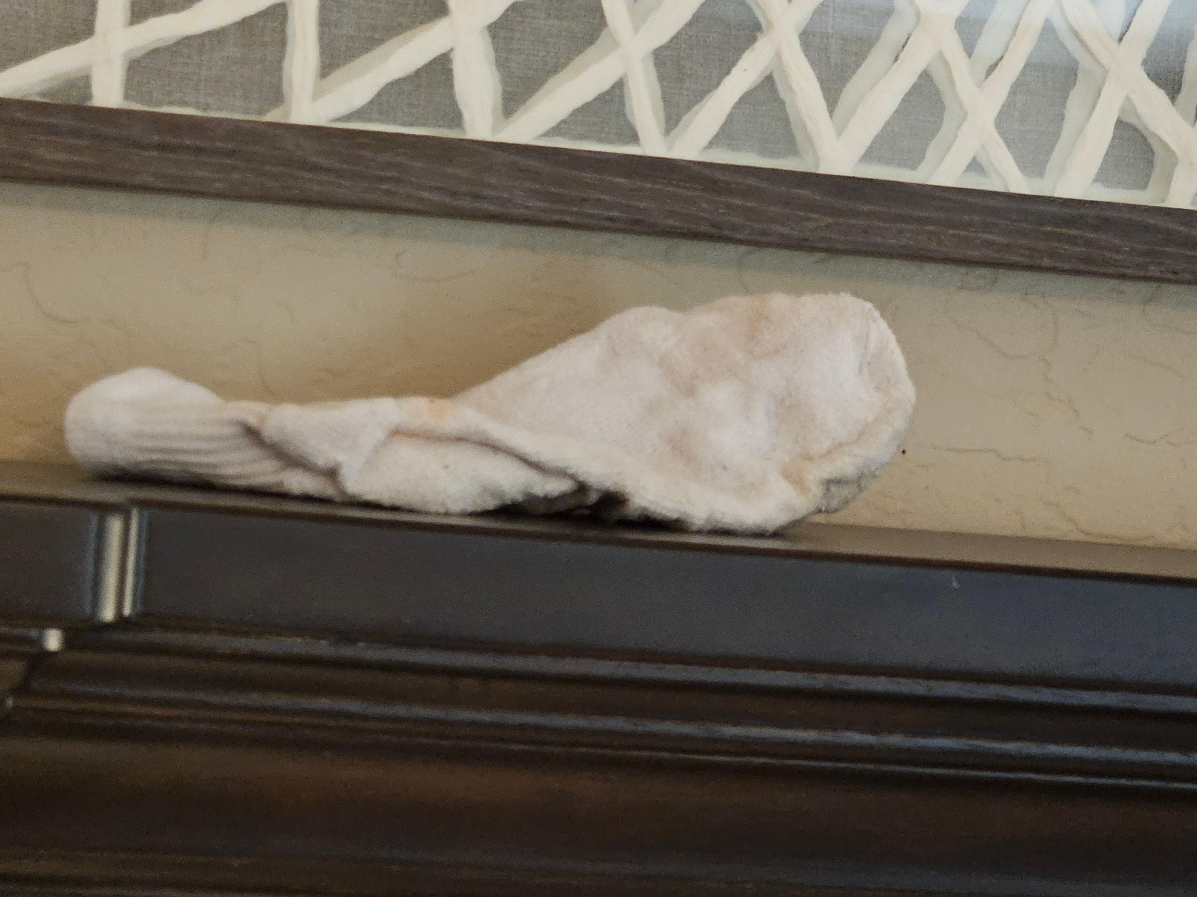 Nasty sock on the headboard. 