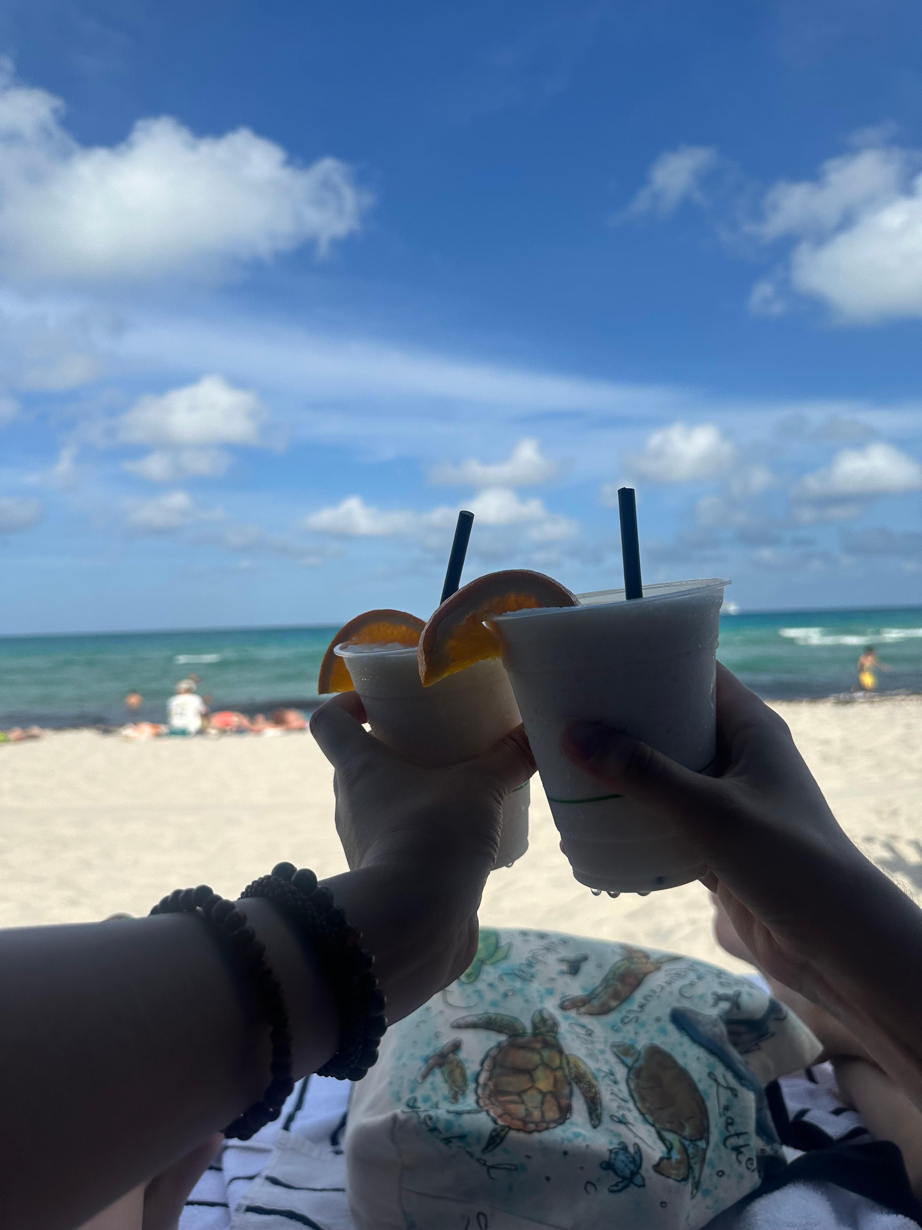 rented a day bed on the beach and ordered two creamsicle cocktails!