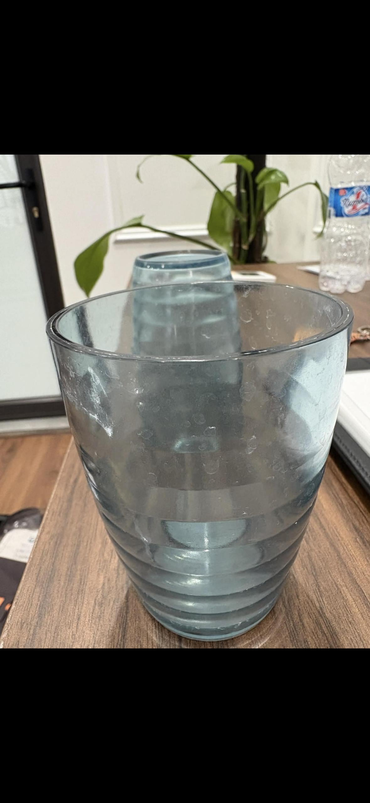 Toothpaste still on glasses from previous guests.