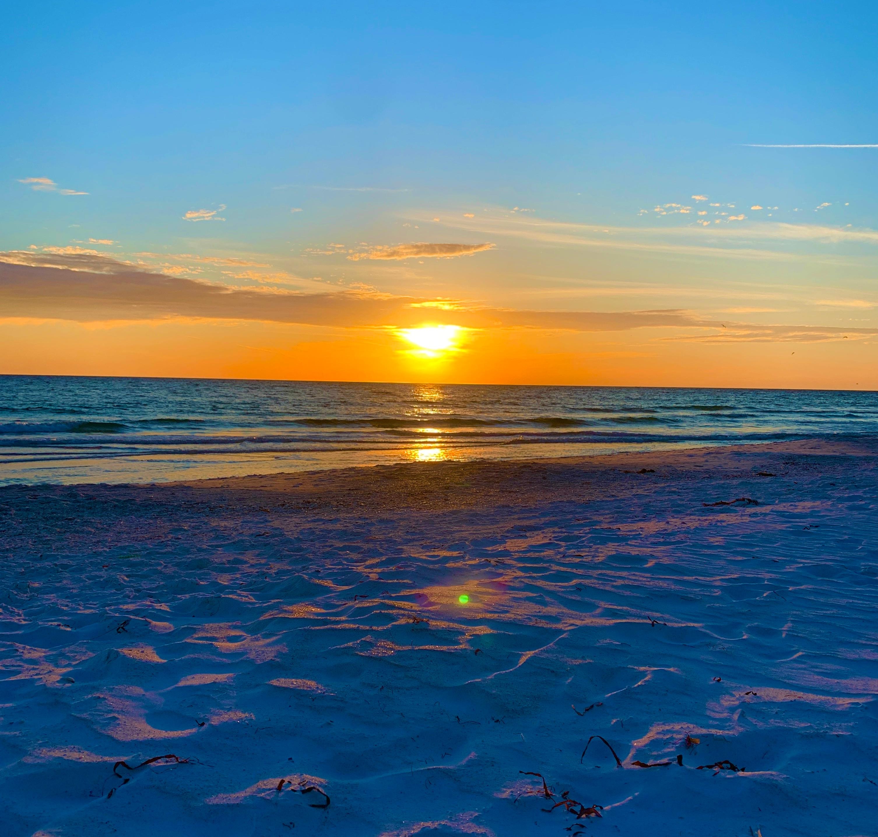 Stunning sunsets just steps away on the beach or from the top deck