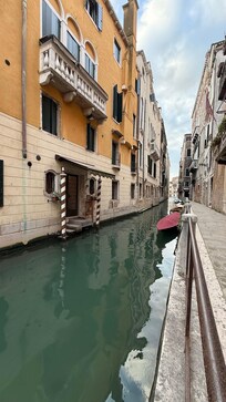 The canal side of the hotel with the door for the water taxi.