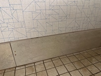 The fluid on the bottom part of this wall was all over bottom of toilet