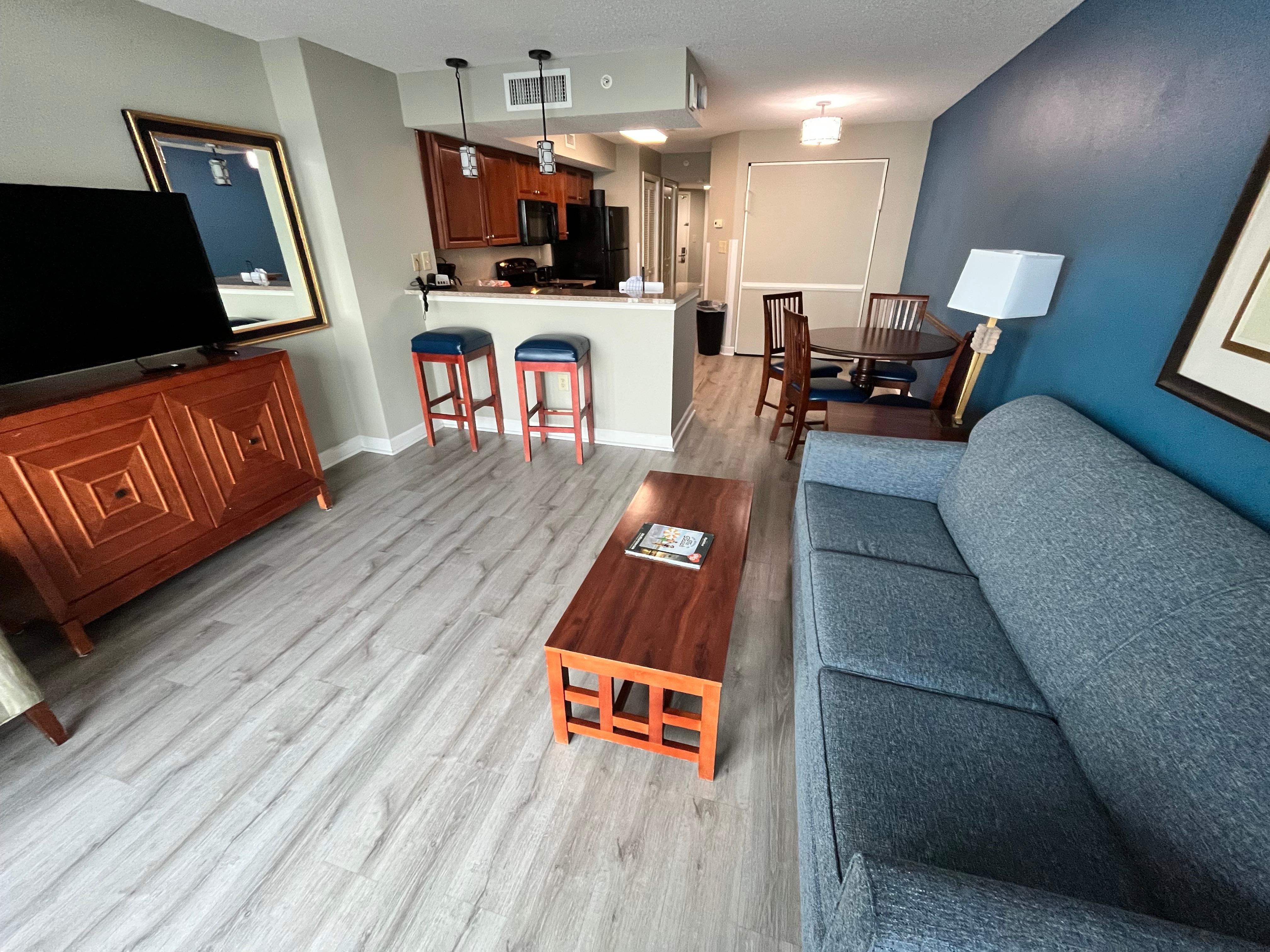 It had a pullout couch, a Murphy bed, and two queen beds in the bedroom. This is a picture of the living room and to the left is the balcony. This condo actually was more spacious than the first apartment that I lived in.