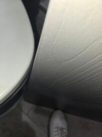 Clearance of door when opened. Lid of commode kept sliding when used, not tightened