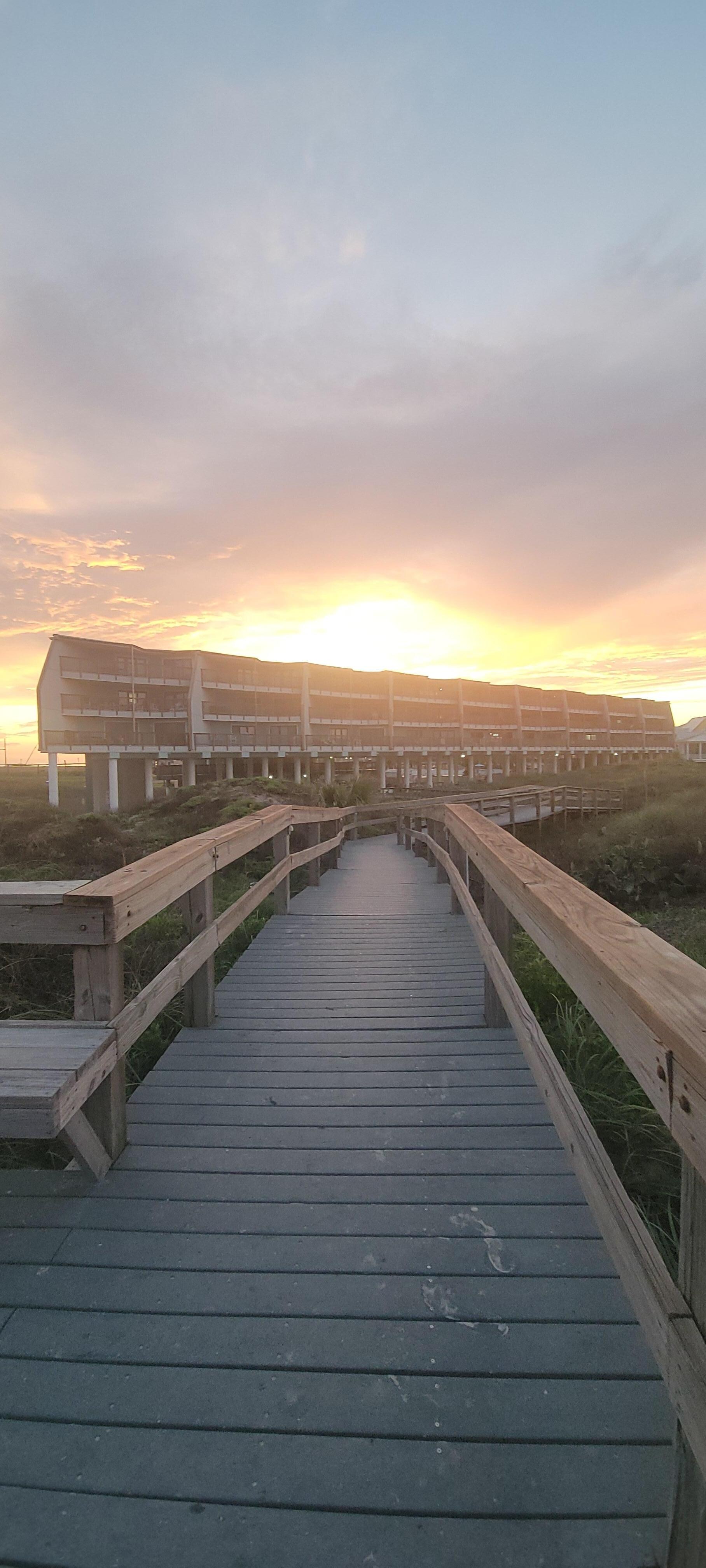 Sunset over the condo from the beach boardwalk