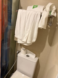 Not very hygienic to hang the towels directly above the toilet.