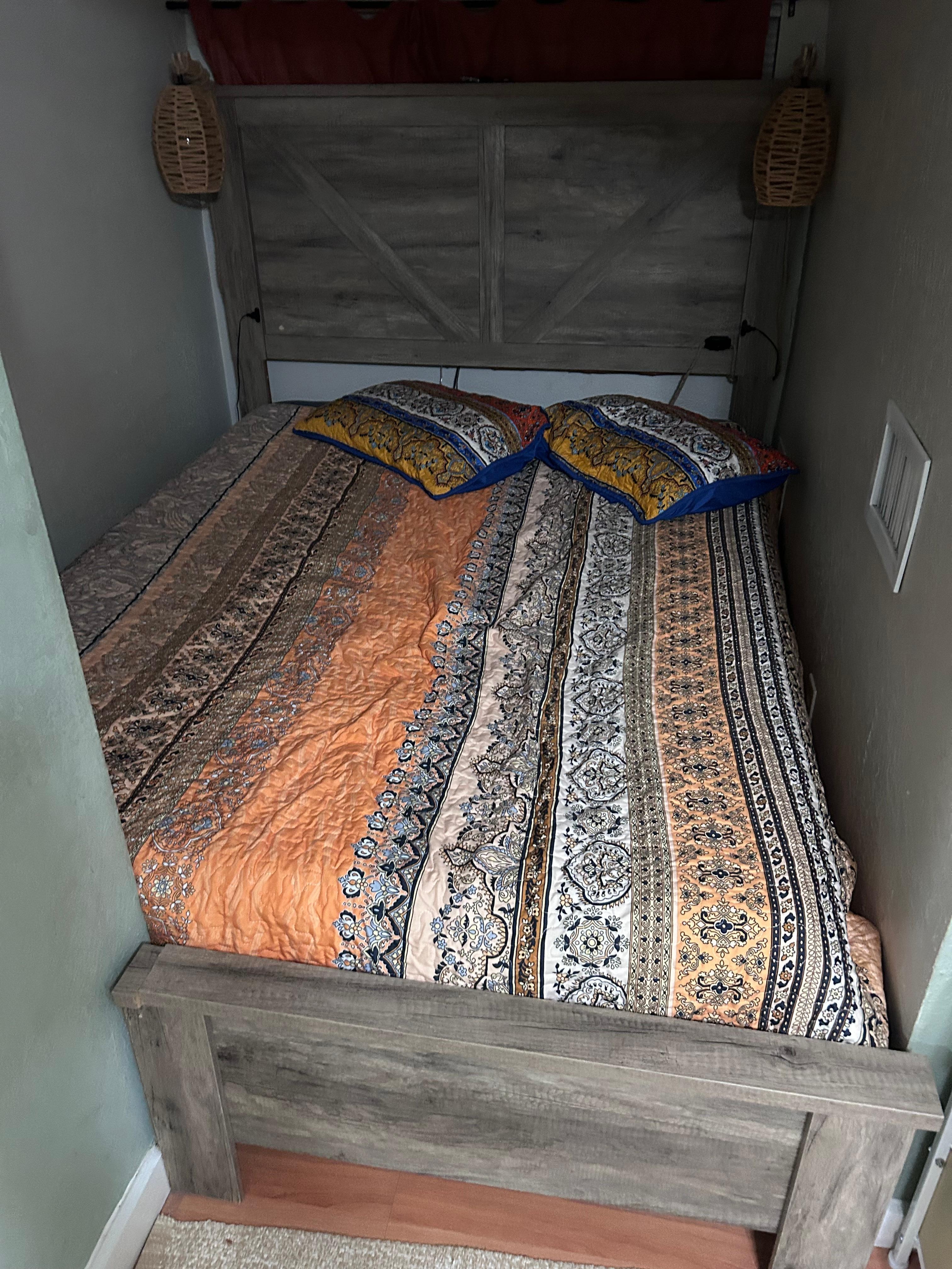 Queen bed surrounded by three walls.  Worse then access to a sailboats V birth