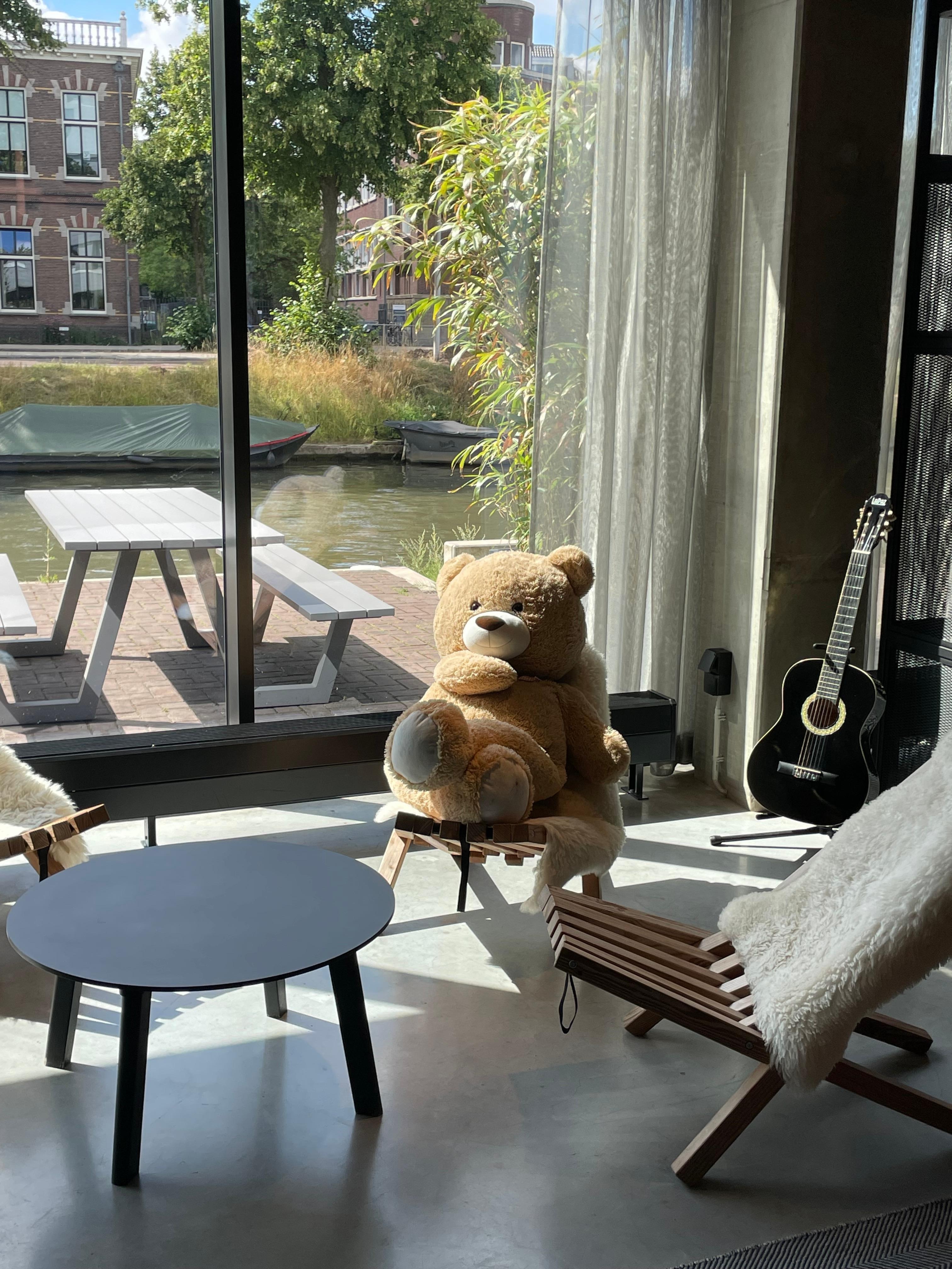 A friendly teddy bear in the lobby