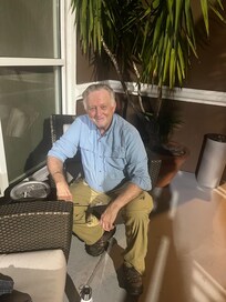 With a friend outside of the hotel-great smoking hut.