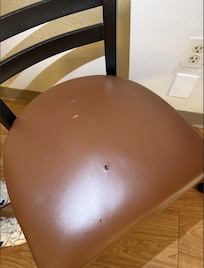 Cigarette whole in the chair