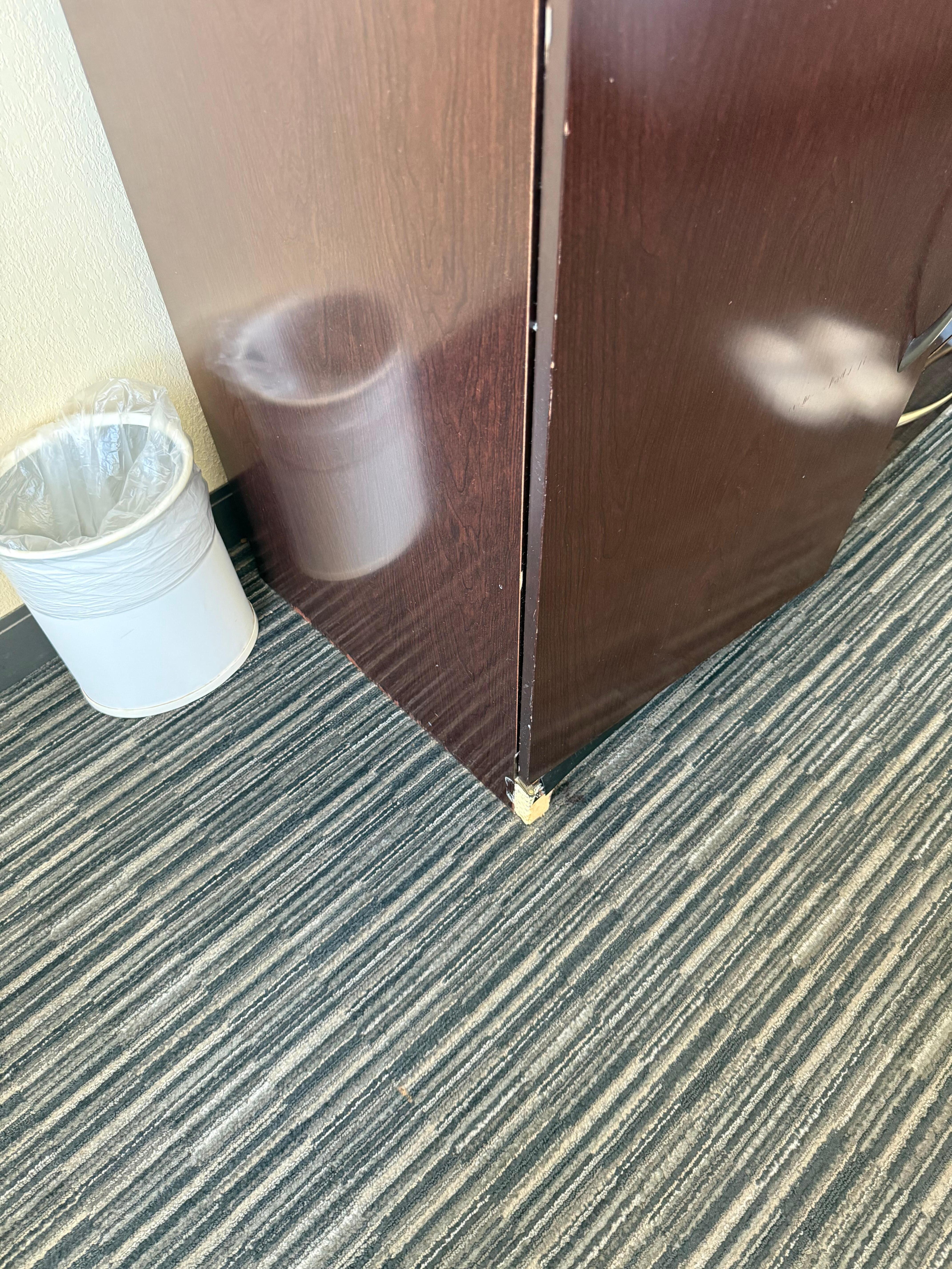 Someone (something?) ate a piece of the tv stand. 