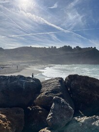 Waves crashing on rocks right across from rooms