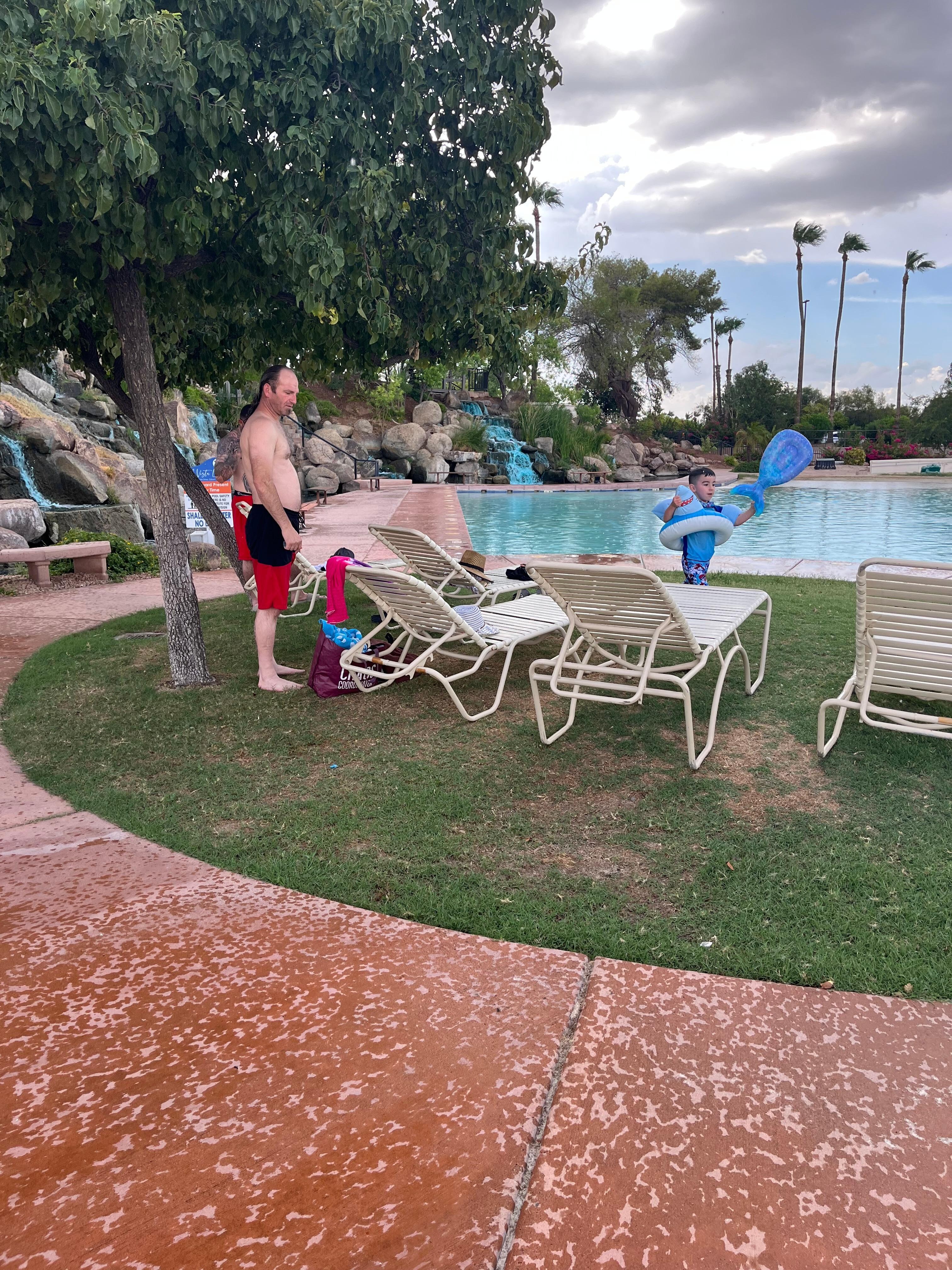 This is the man-made pool at the clubhouse. It has a sandy beach and grass, which was very nice.