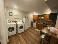 Nice clean kitchen with laundry.