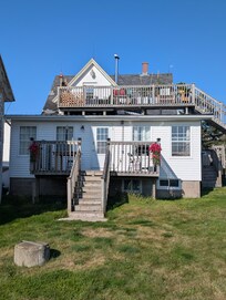 Rear view with both deck lofts of the property.