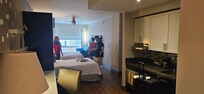 Room with 2 queens and sleeper sofa.