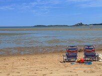 View at low tide of the bay beach at hills beache.