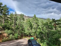 View out front, from 2nd floor, with afternoon clouds.