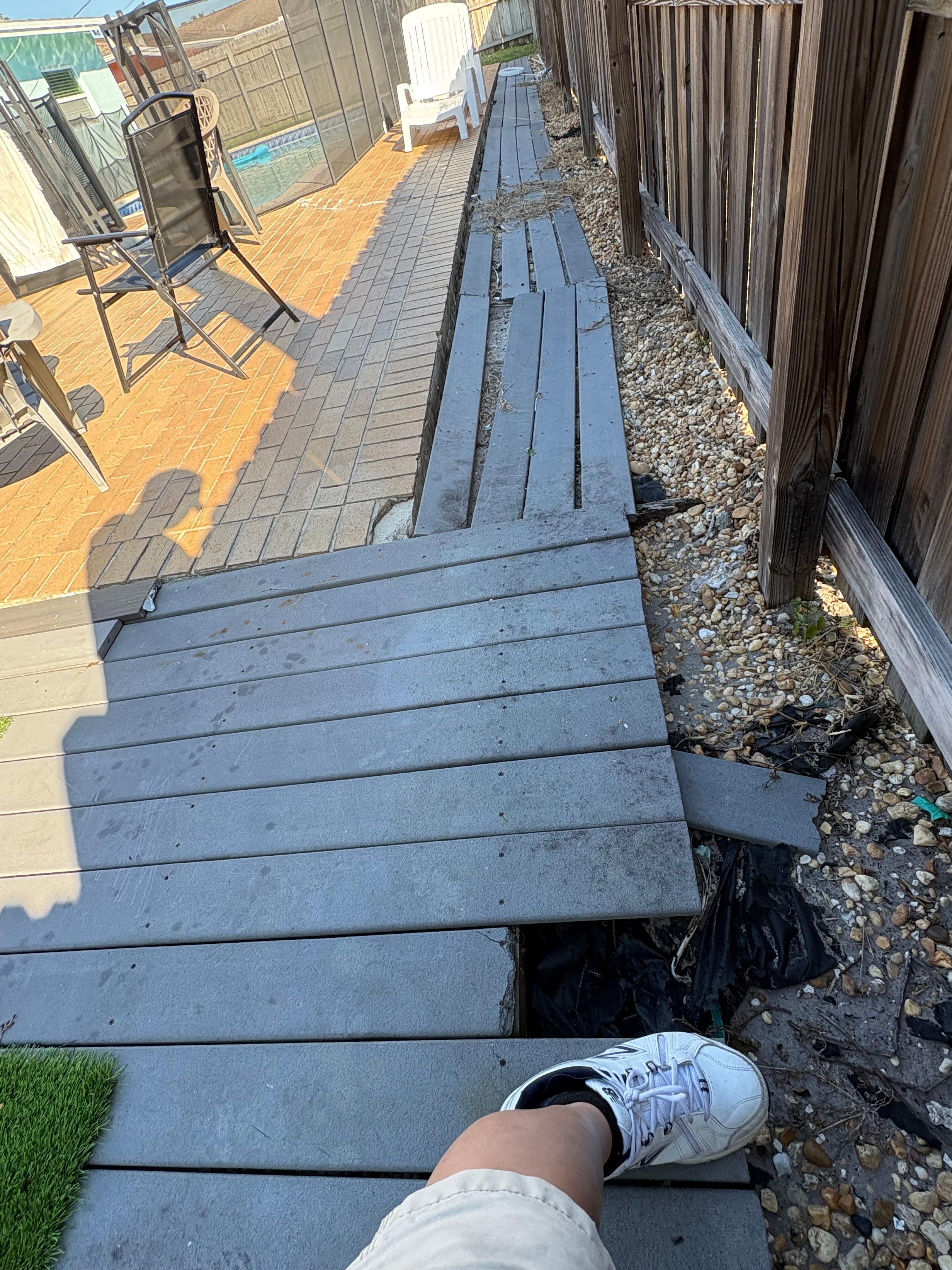 Rotting broken and hazardous decking.  Exposed metal anchors that slice open any bare foot.  