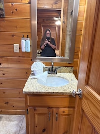 This is the downstairs bathroom it could’ve had a longer cabinet I think