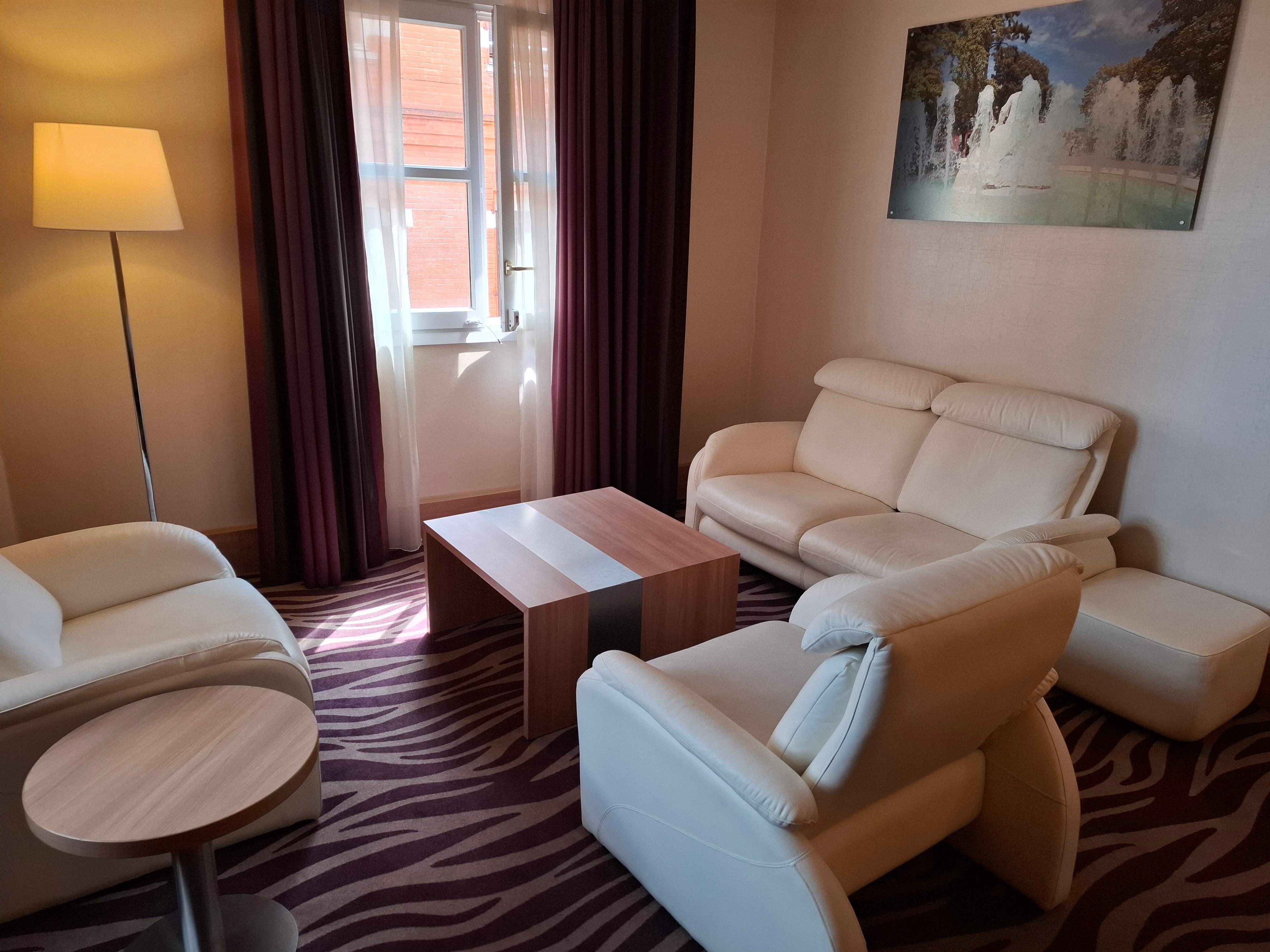 Settee and two chairs including two reclining seats.  Room is brighter than appears from photo because there is a second window.