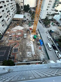 These pix are the actual view from the "private rooftop patio" when looking toward the bay (the same direction as on the vrbo's pic). The building on the right in the top pic (& middle in the lower one is the same as the building in the vrbo picture.