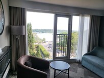 A area to seat while in the room and enjoy the beautiful view.