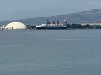 Queen Mary visible from the beach walkway