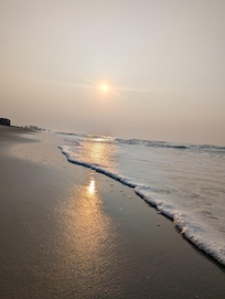 Sunrise to the left of the resort